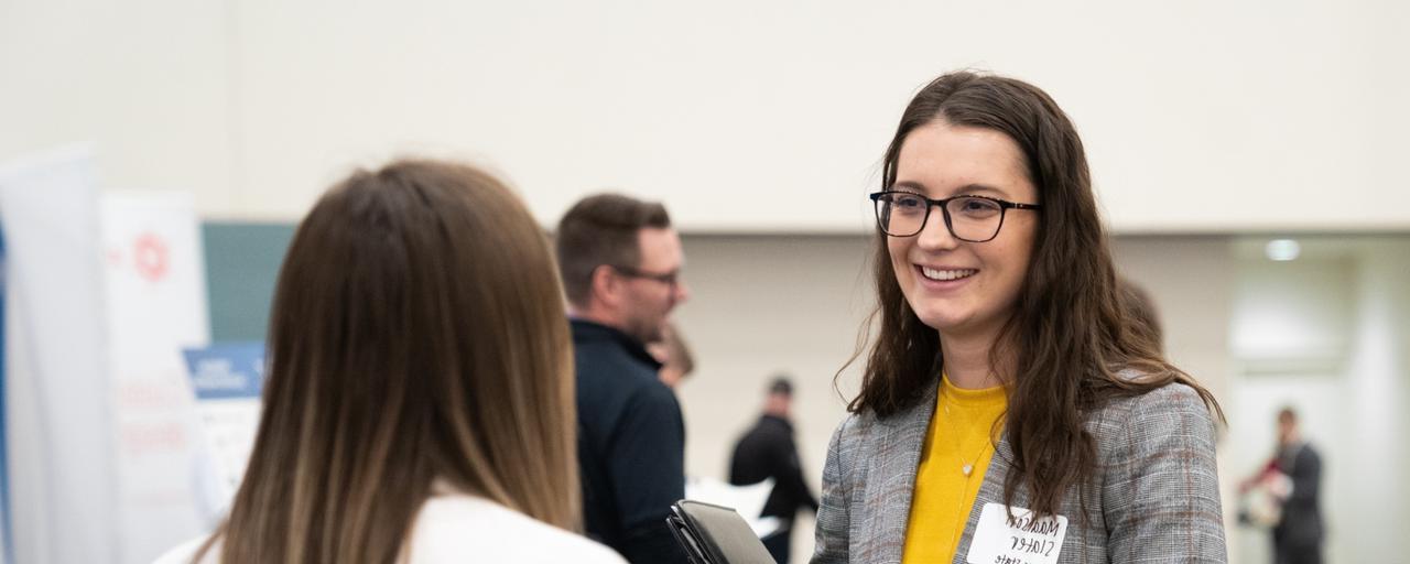 people talking at a career fair